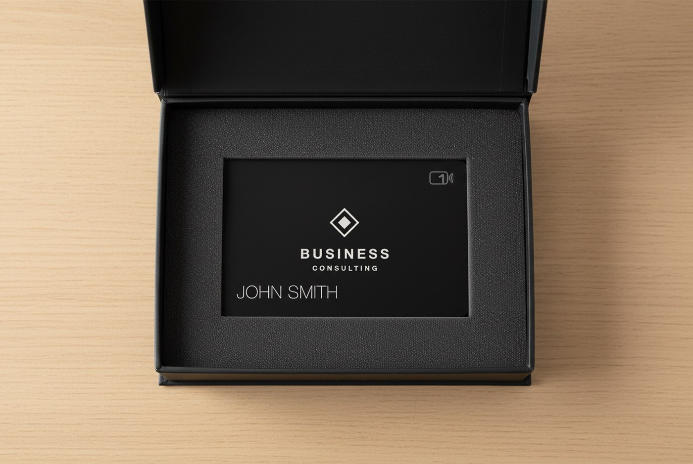 Black metal card nestled in a matte black magnetic presentation box